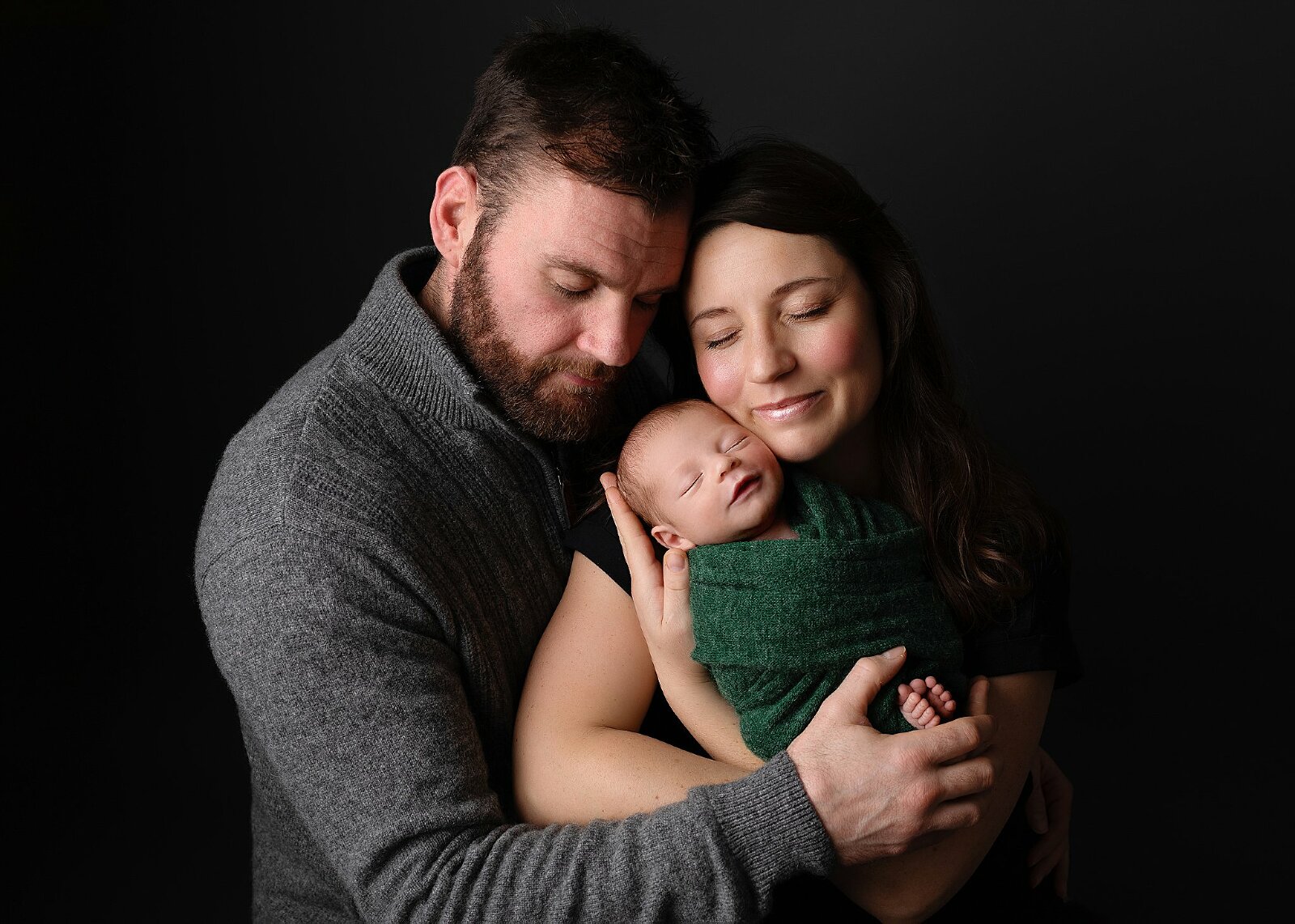 newborn baby boy in parents arms. photo studio hereford, Herefordshire, cheltenham